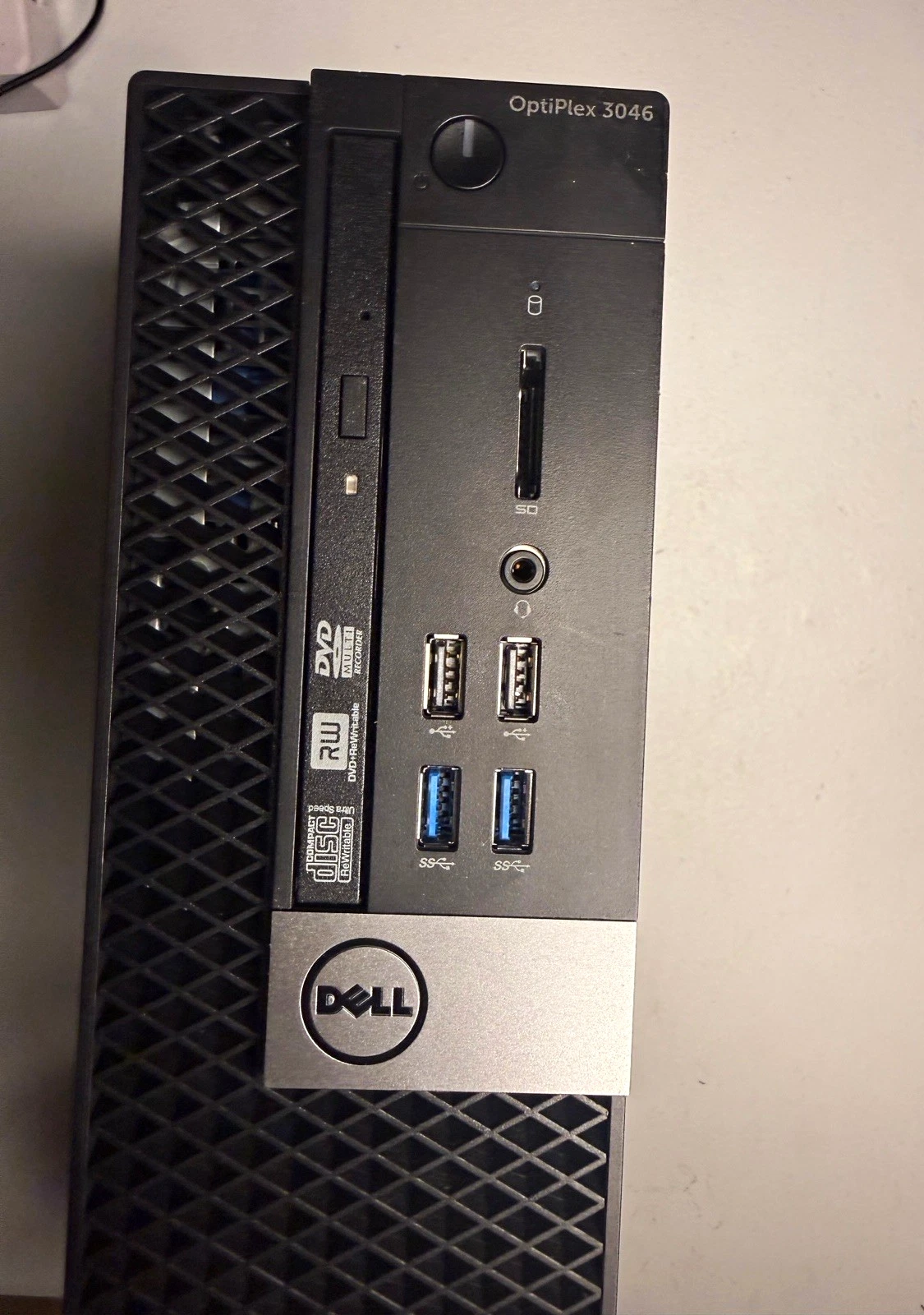 Front of the Dell OptiPlex 3046 small form factor, with the optical drive, USB ports, SD card slot, power button, and Dell logo